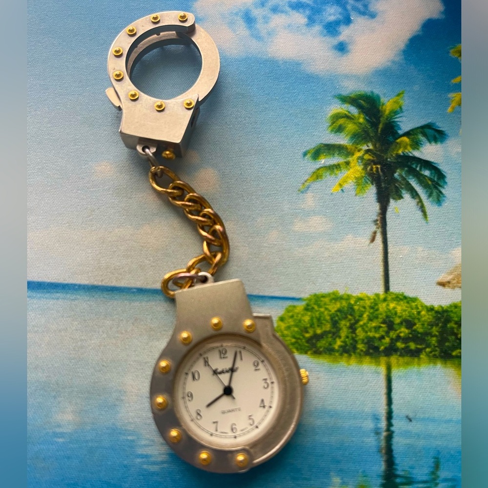 Pocket watch mini handcuffs by Quartz